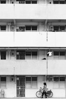 white concrete building with white window blinds