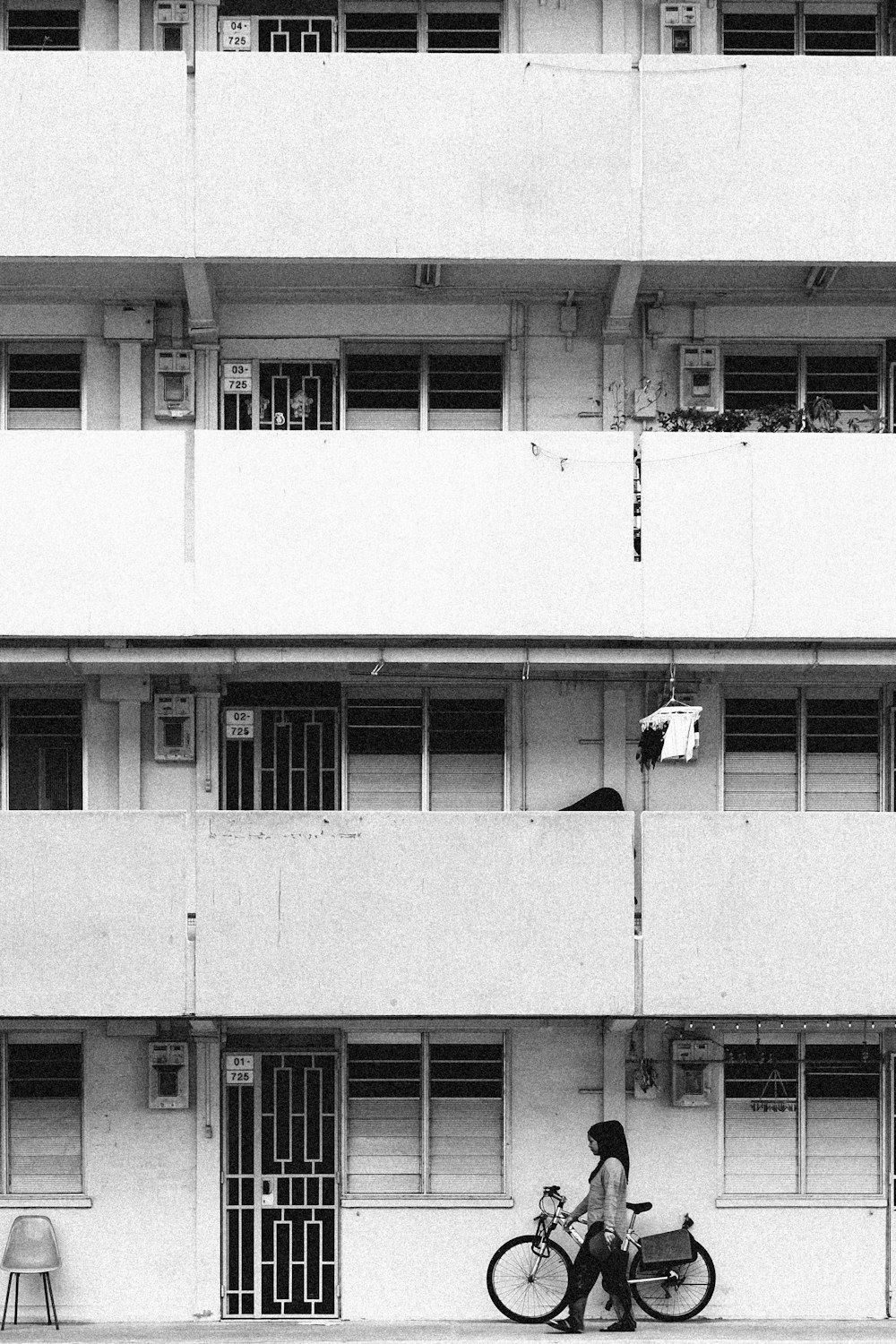 white concrete building with white window blinds