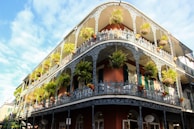 brown and white concrete building under blue sky during daytime