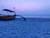 yellow and black boat on beach during daytime