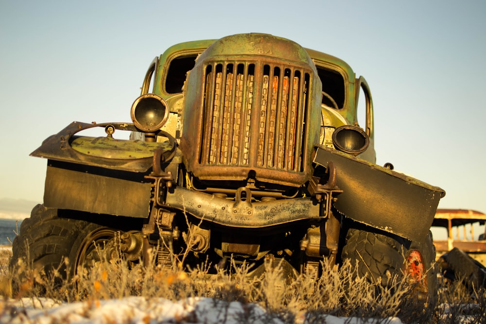 vintage brown car on brown grass field