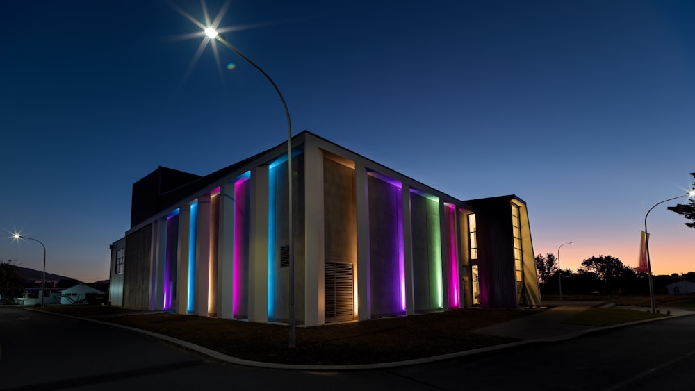 purple green and yellow lighted building during night time