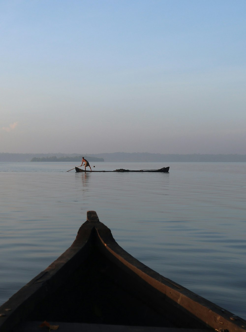 person riding on boat on sea during daytime