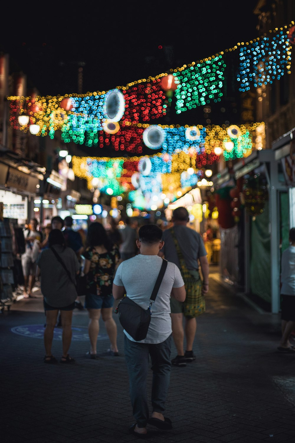 people walking on street during night time