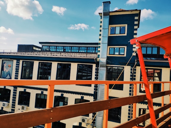Photo of a freshly painted industrial warehouse exterior with clean lines and bright colors.