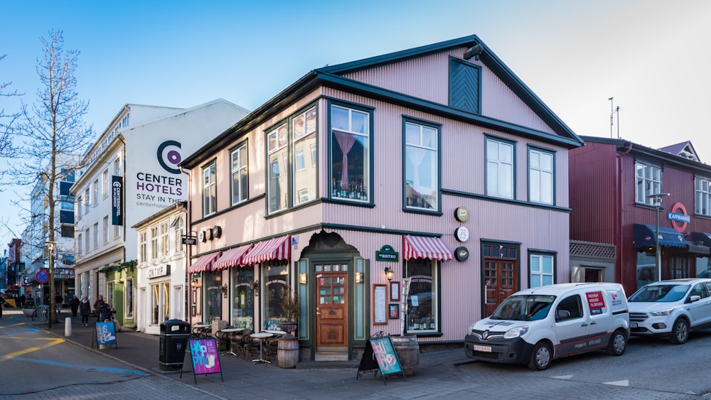 cars parked in front of store during daytime