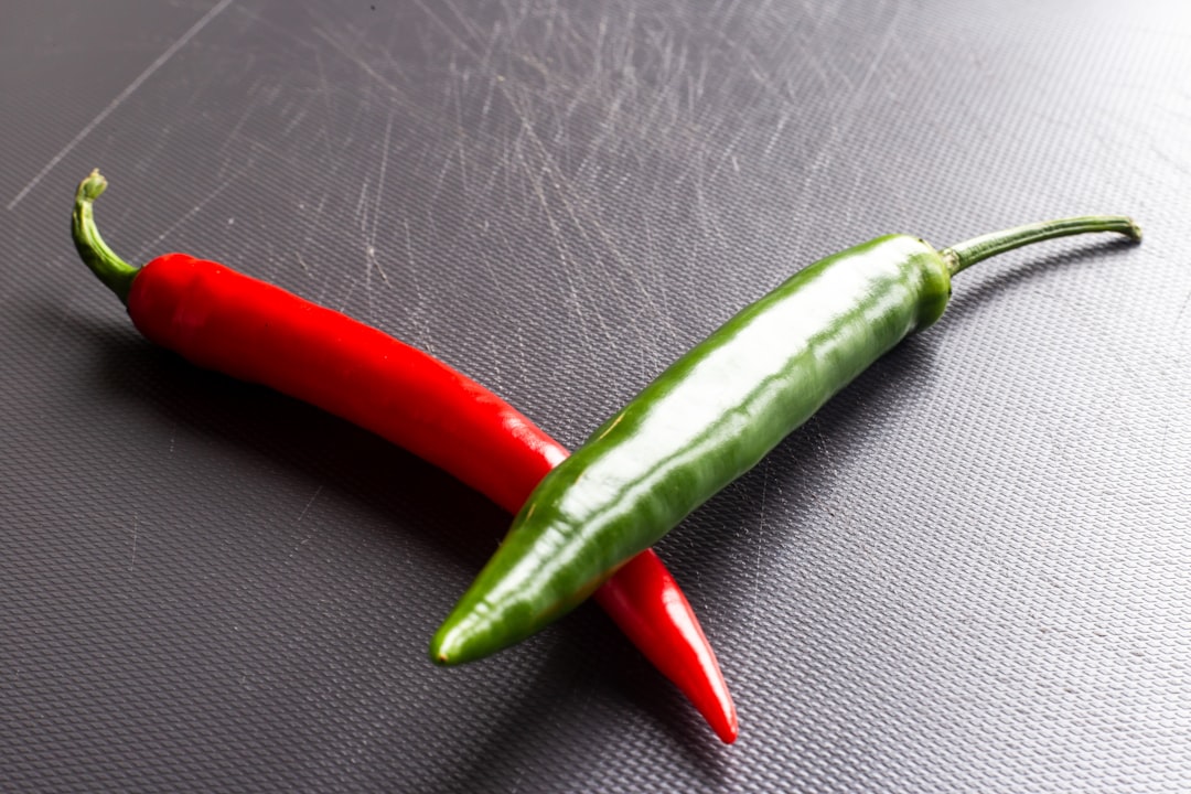 red chili on gray textile