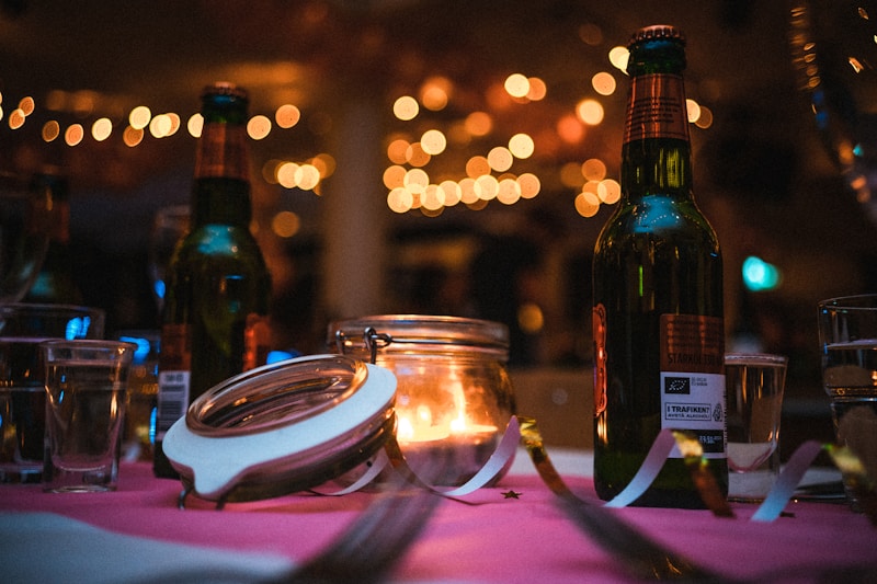 clear glass candle holder with lighted candles