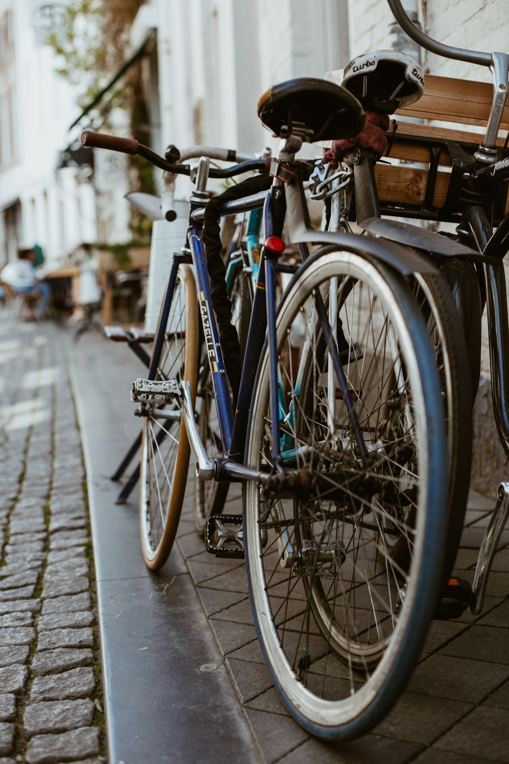 black city bike on sidewalk during daytime