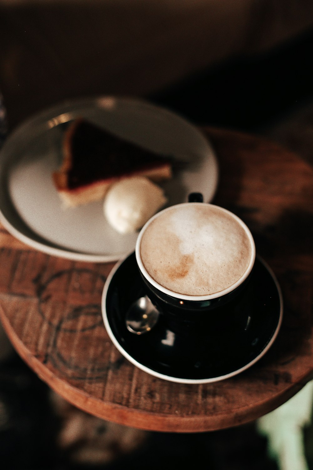 black ceramic mug on black saucer