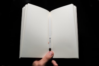 person holding white printer paper