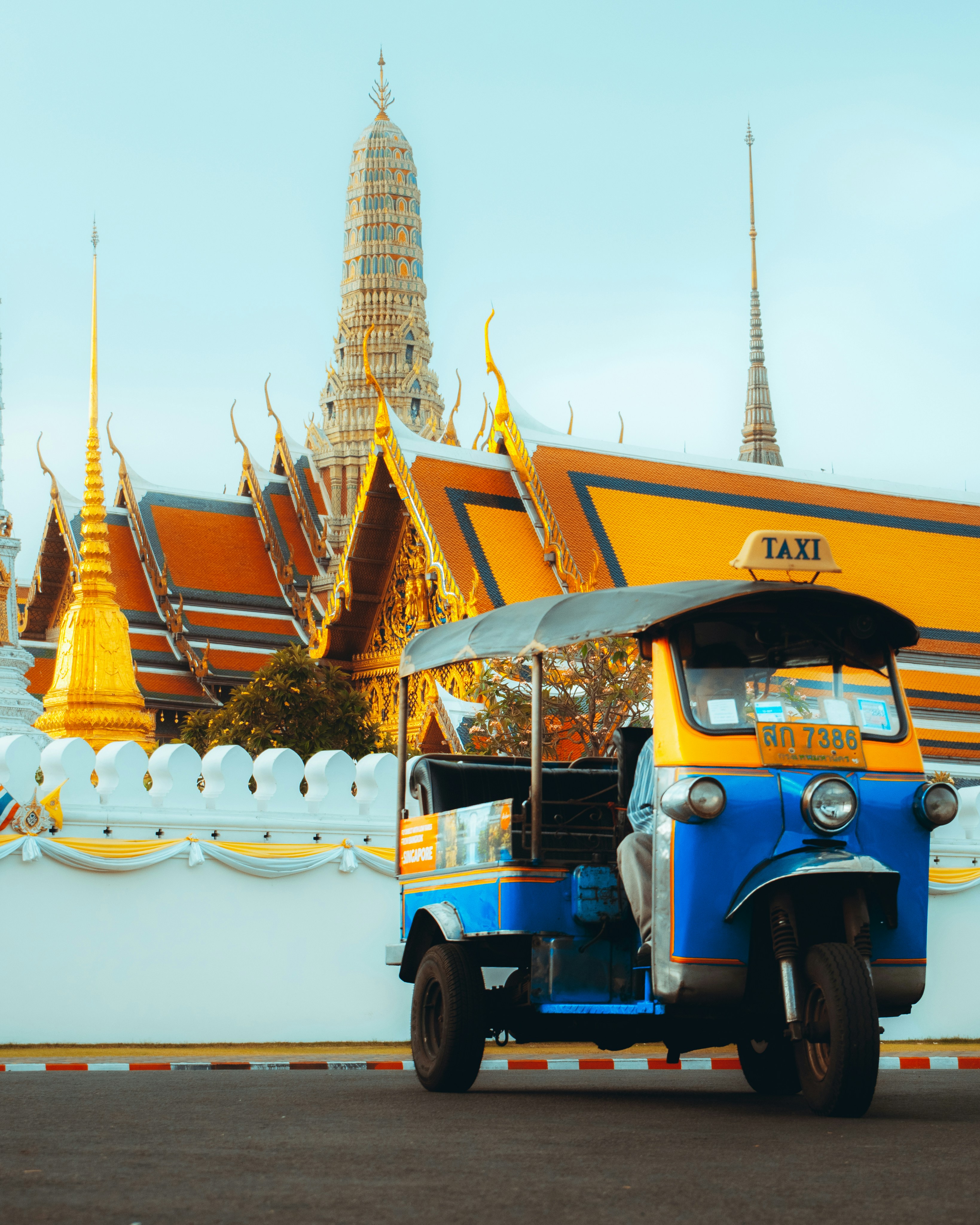 I was standing on an island in the middle of the road outside the Grand Palace, and this Tuk-tuk randomly drove by and parked right in this spot. At first, I wasn't going to capture it but I thought that it was too unexpected and coincidental to not take a photo of. It turned out to be one of my favourite photo to date.