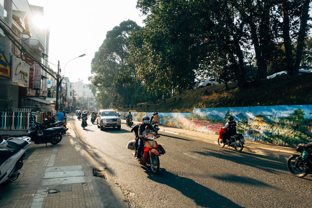 people riding motorcycle on road during daytime