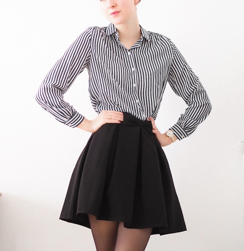 Woman wearing midi skirt with fitted jumper for relaxed office style