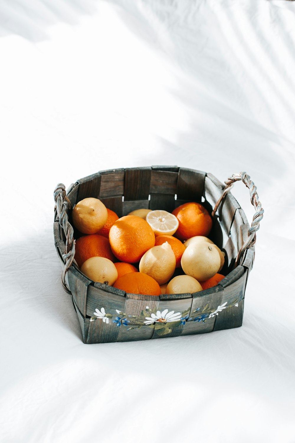 orange fruits in black steel basket