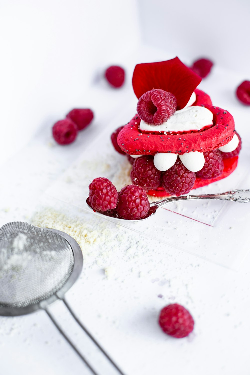 red raspberries on white paper