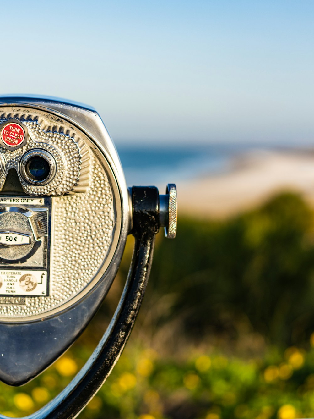 black and silver coin operated binoculars