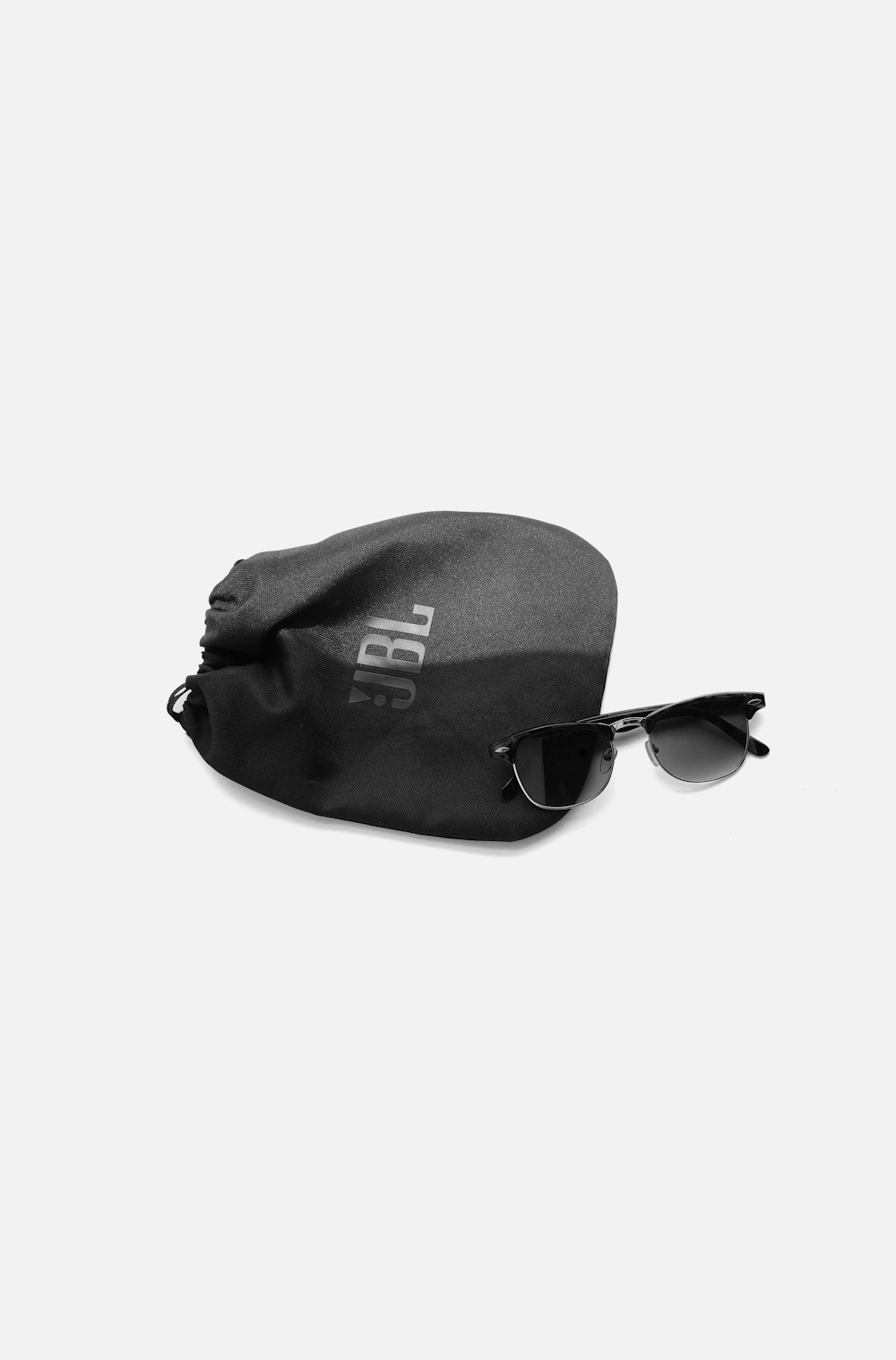 black sunglasses on black cap