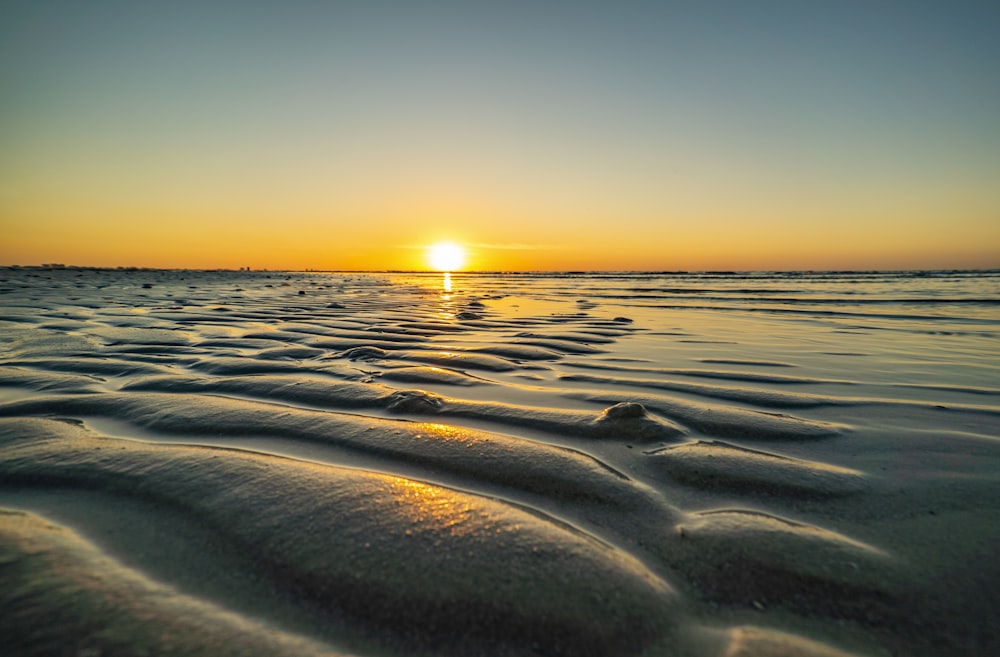 body of water during sunset