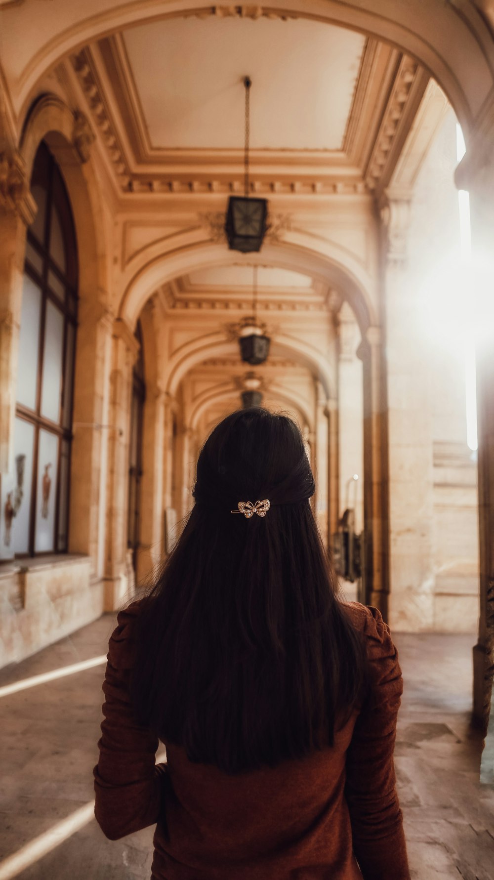 woman in black hijab standing on hallway