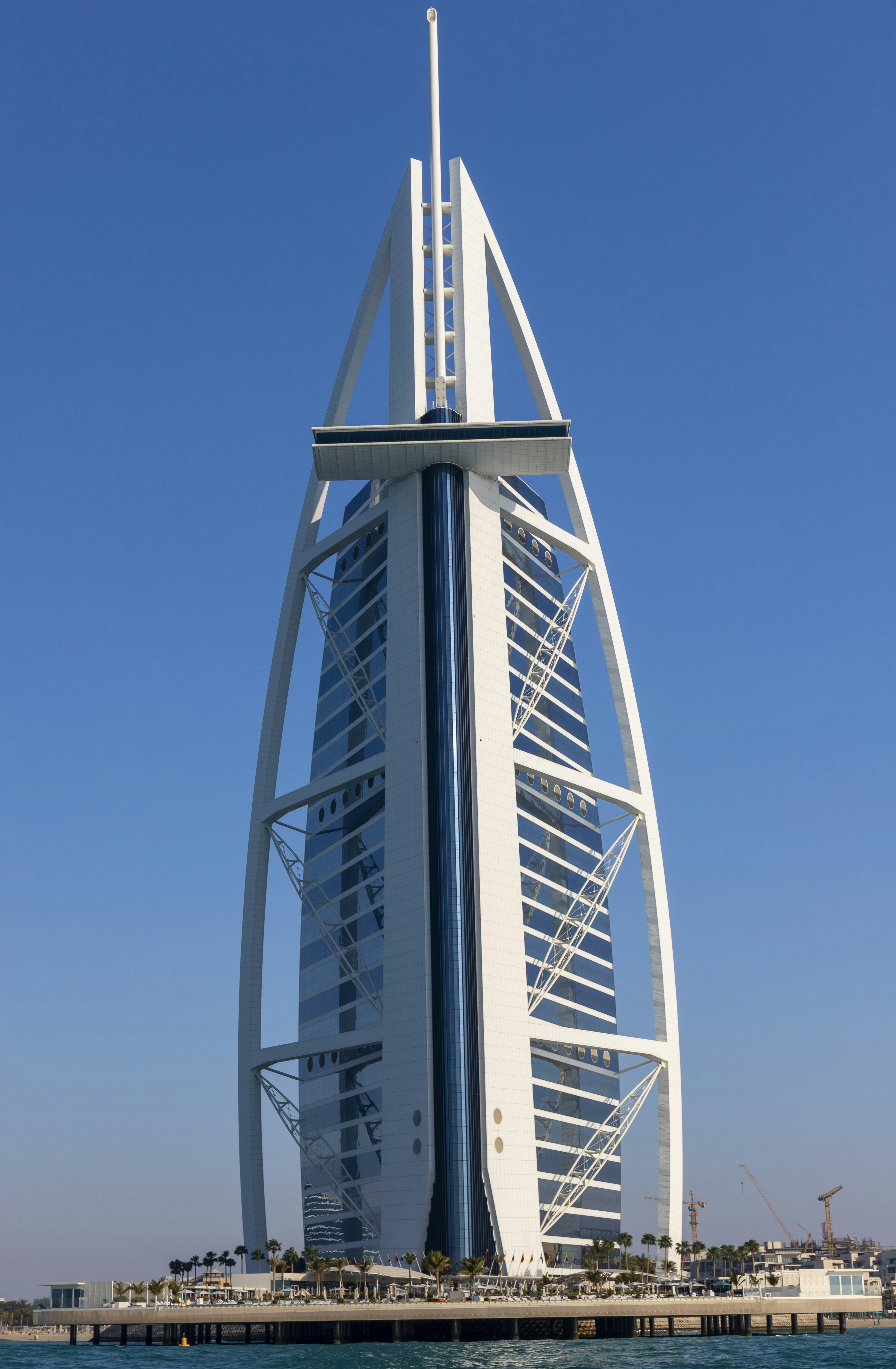 a very tall building sitting on top of a body of water