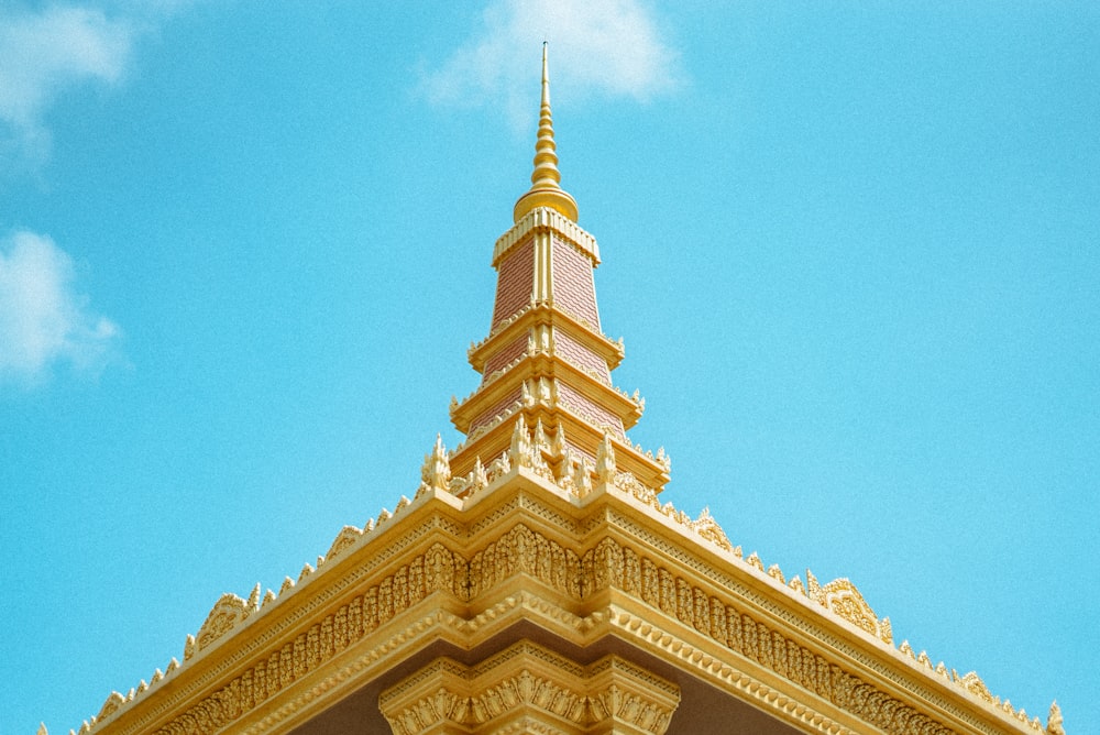 brown and beige concrete building under blue sky during daytime