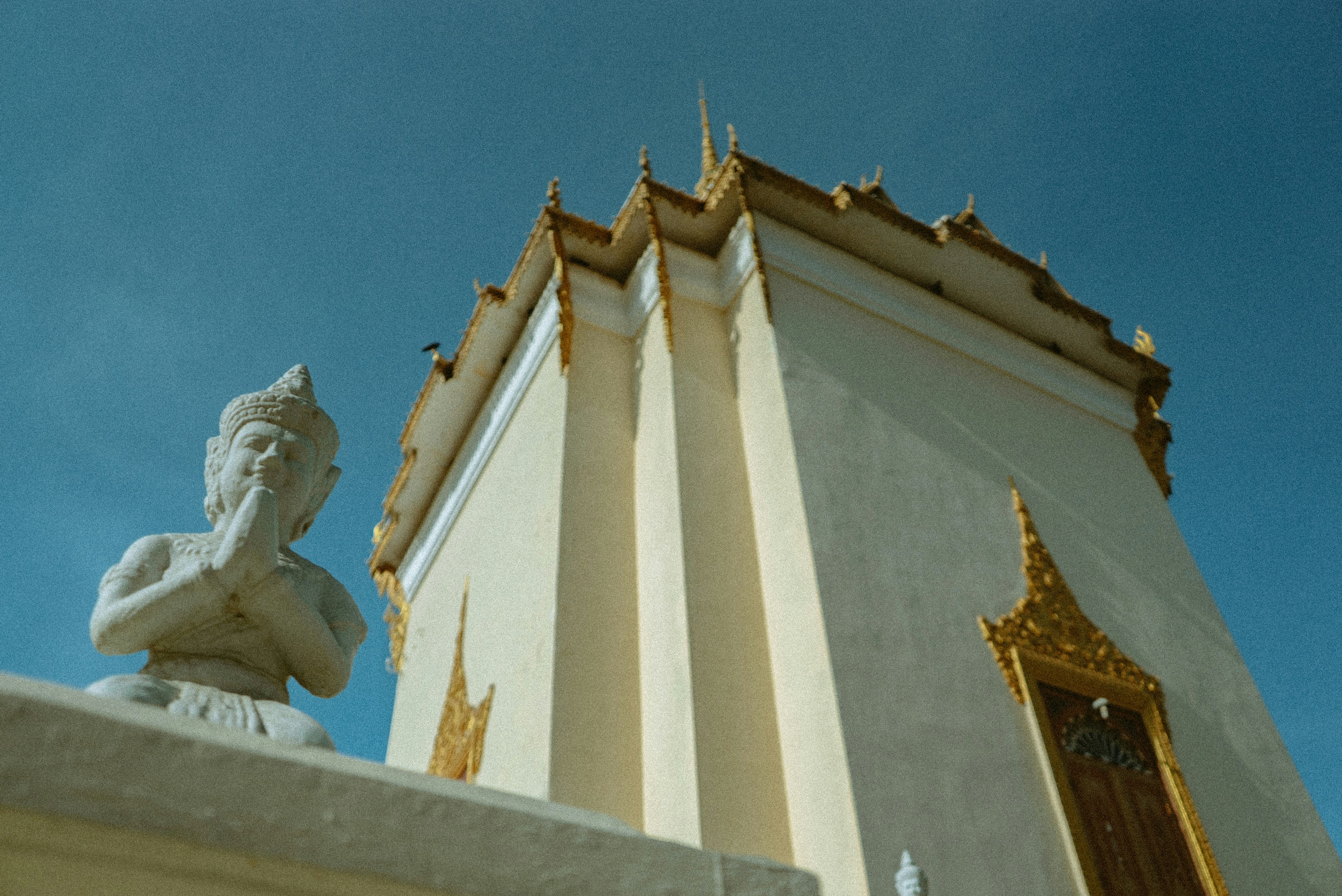 white concrete building under blue sky during daytime