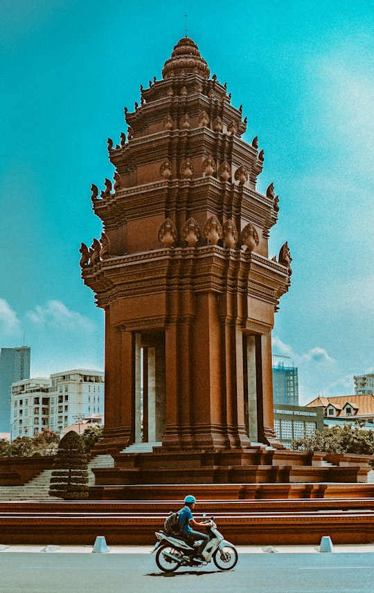 brown concrete building under blue sky during daytime in Independence Monument Cambodia