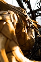 A detailed shot of a finished cardboard sculpture resembling an animal figure.