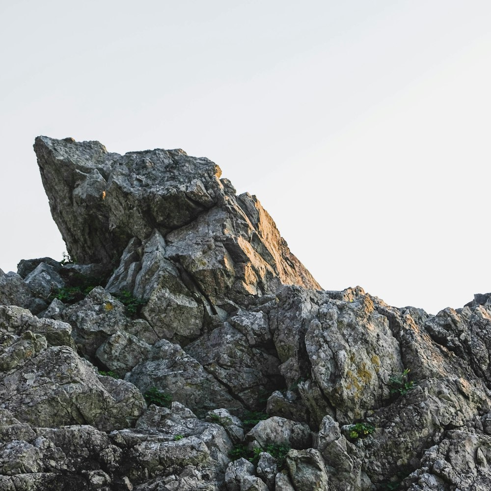 gray rocky mountain under white sky during daytime