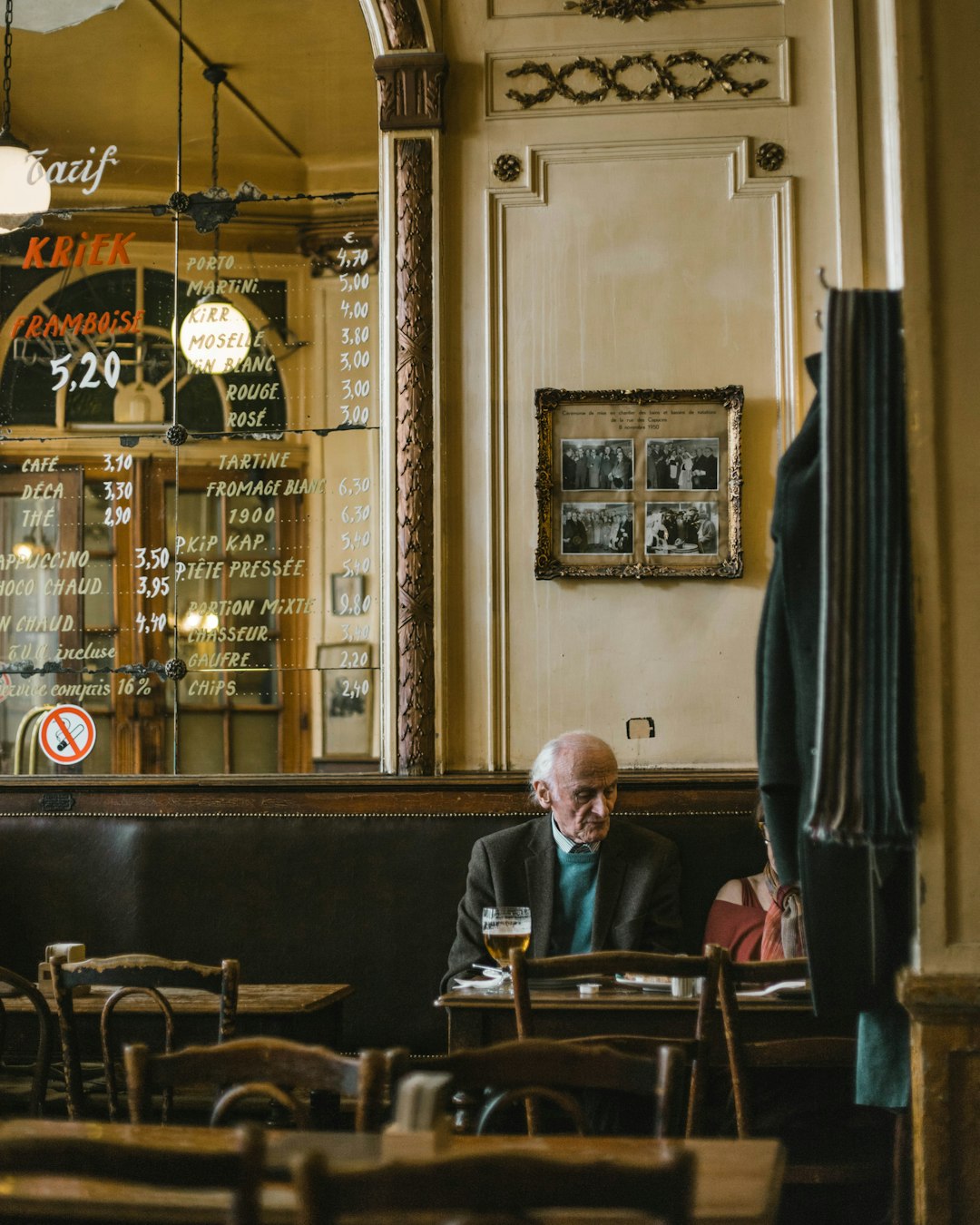 man in black suit sitting on black leather chair