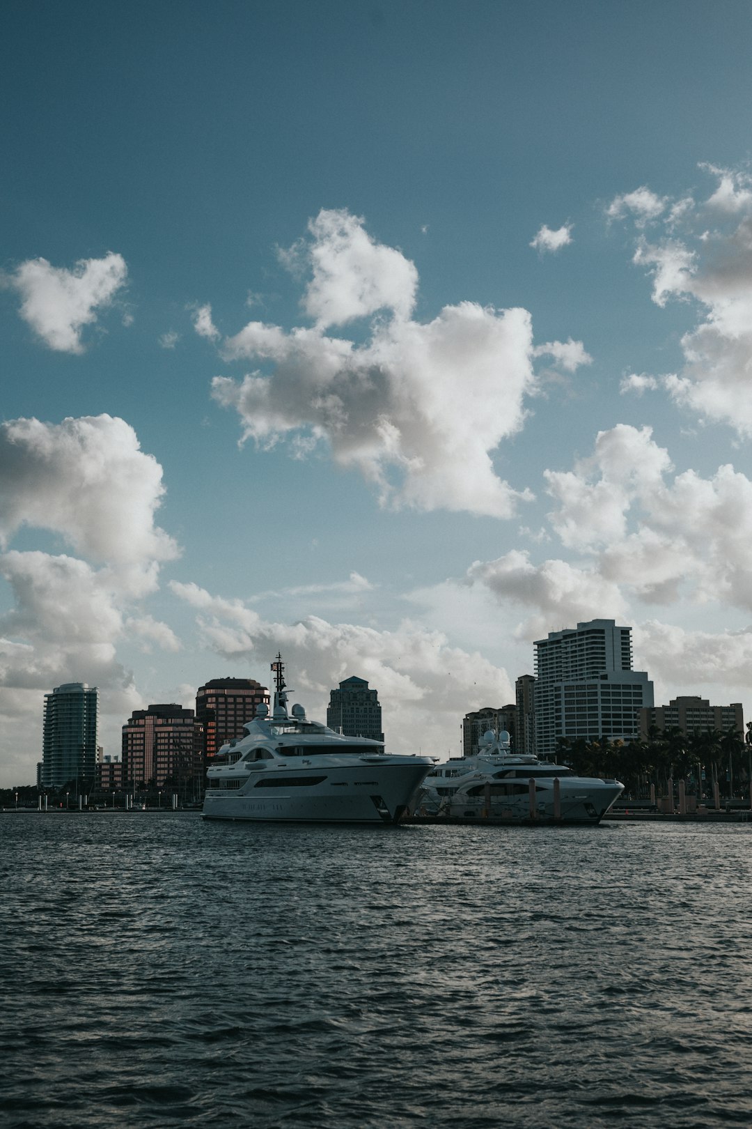 white cruise ship on sea under blue sky and white clouds during daytime