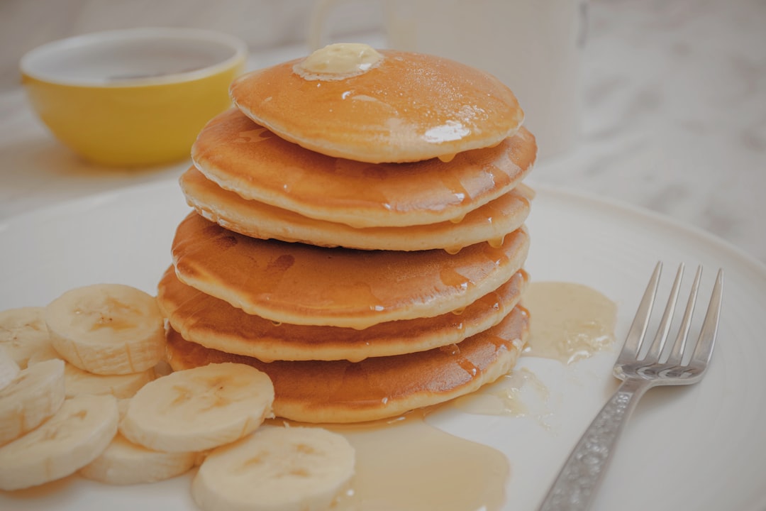 brown pancakes on white ceramic plate