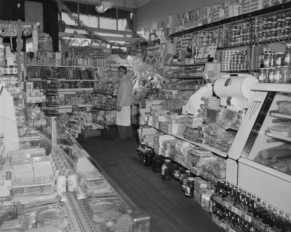 grayscale photo of people in market