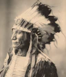 man in white and black feather headdress