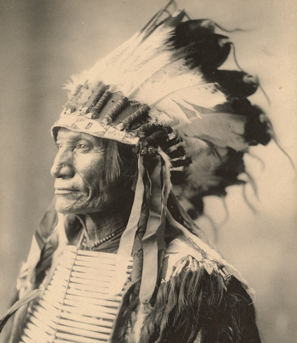 man in white and black feather headdress