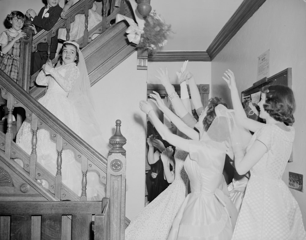 grayscale photo of bride and groom dancing