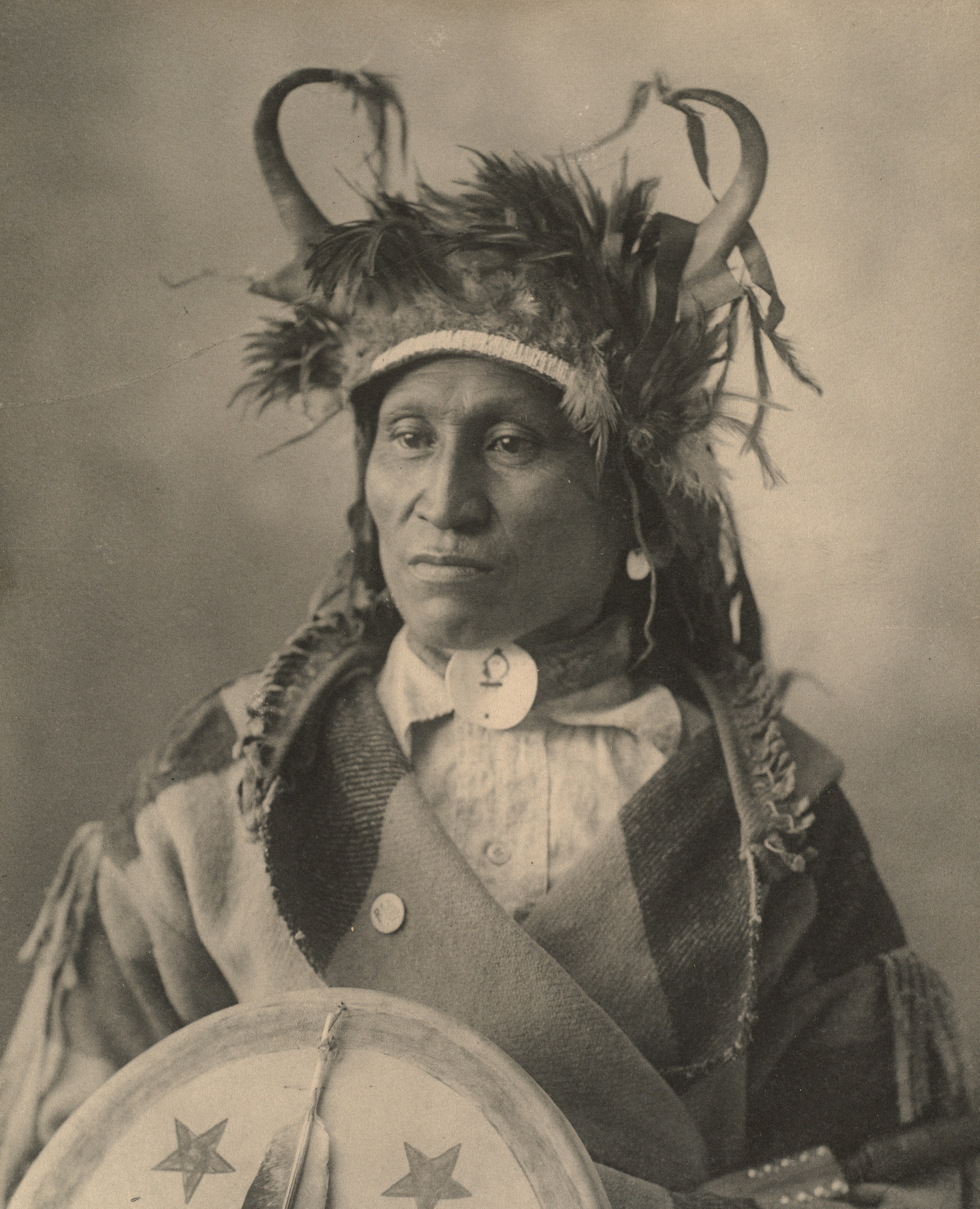 man in brown and white hat