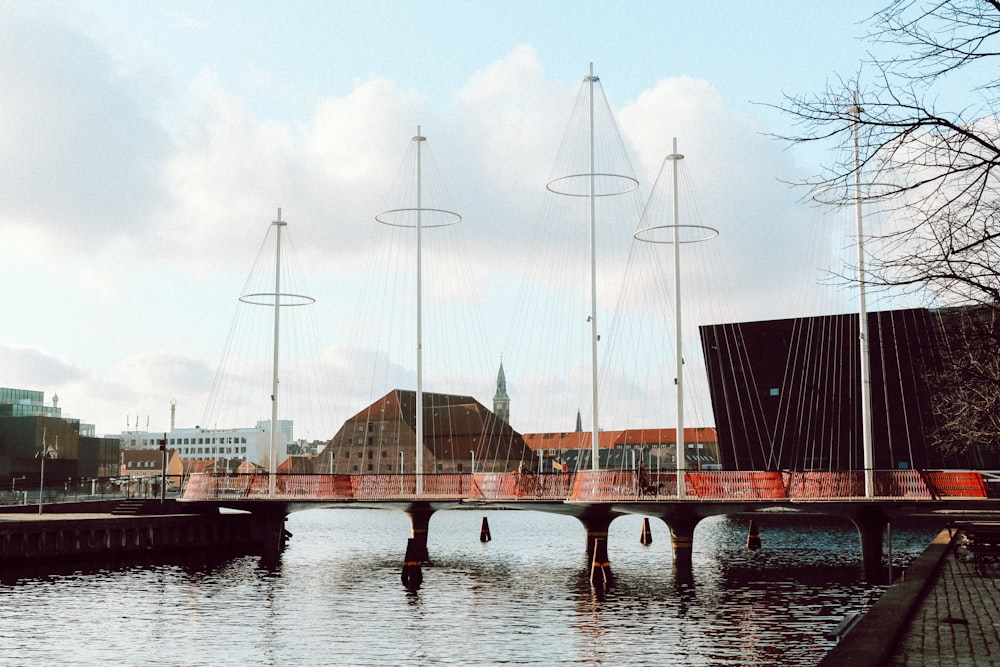 brown wooden bridge over river during daytime