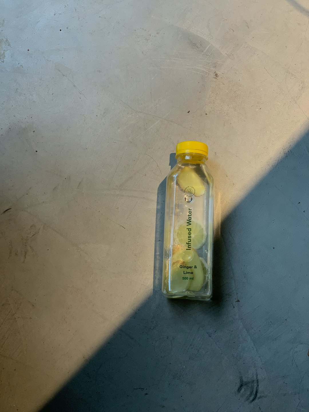 yellow plastic bottle on white table