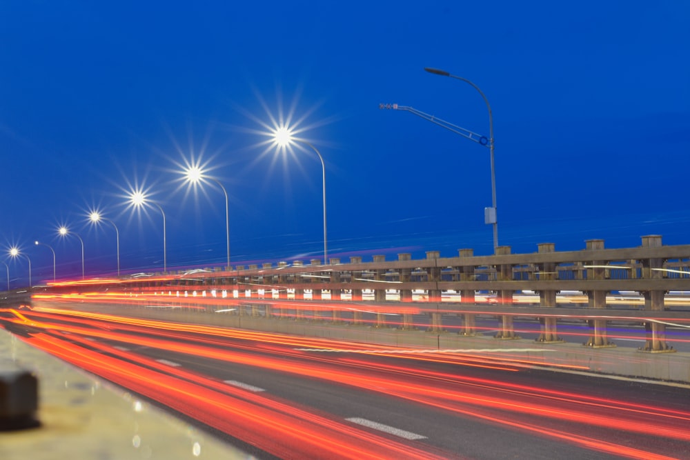 time lapse photography of cars on road during night time