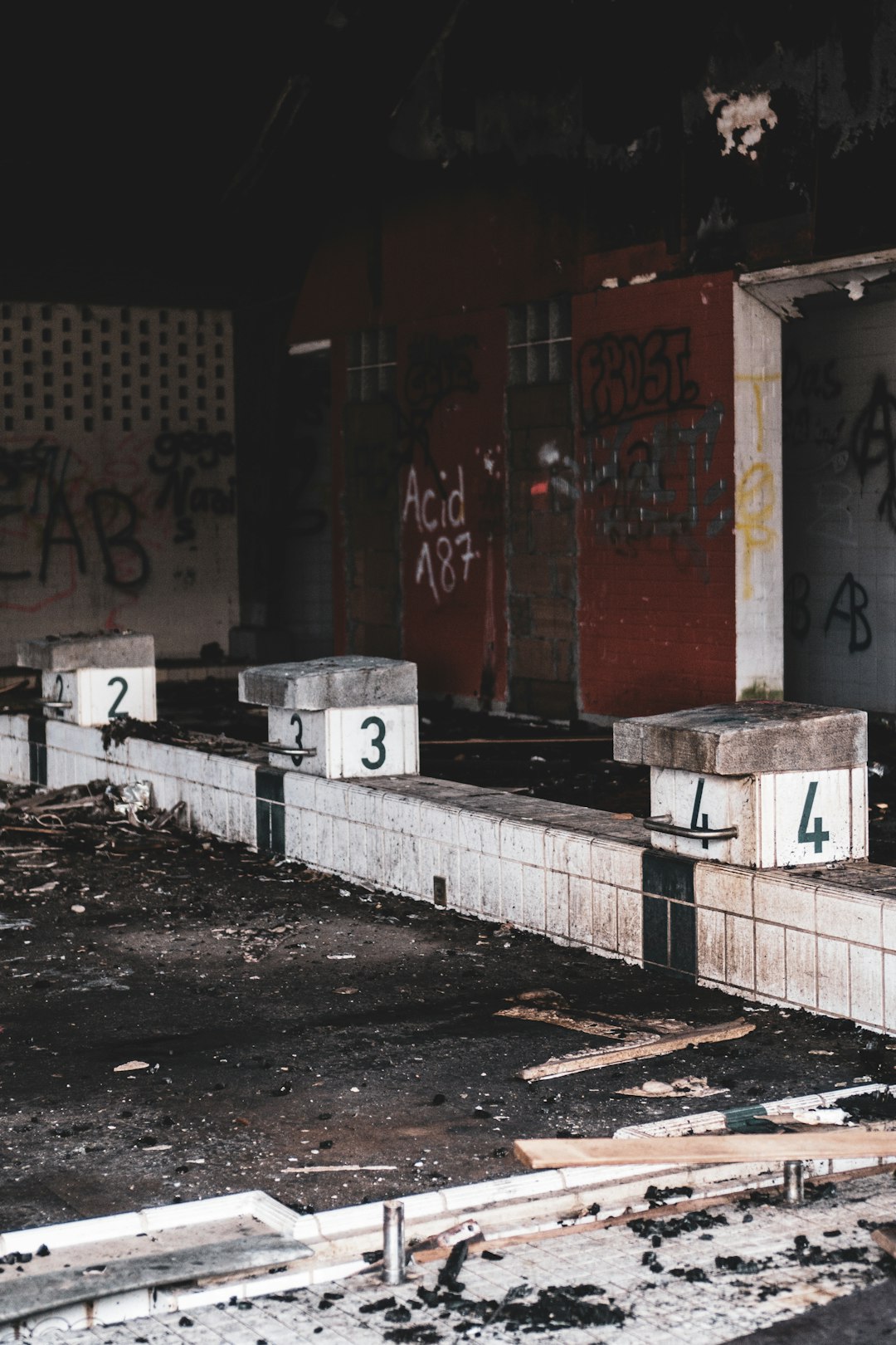 red and white wall with graffiti