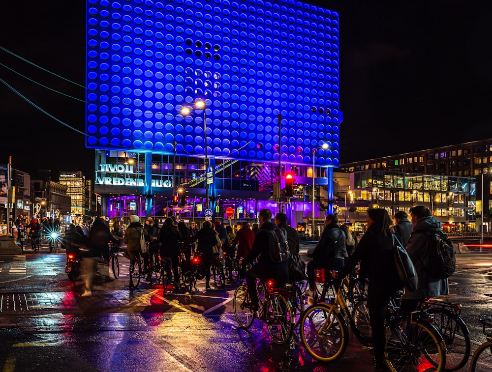 people walking on street during night time