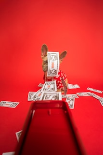 white and red robot on red table