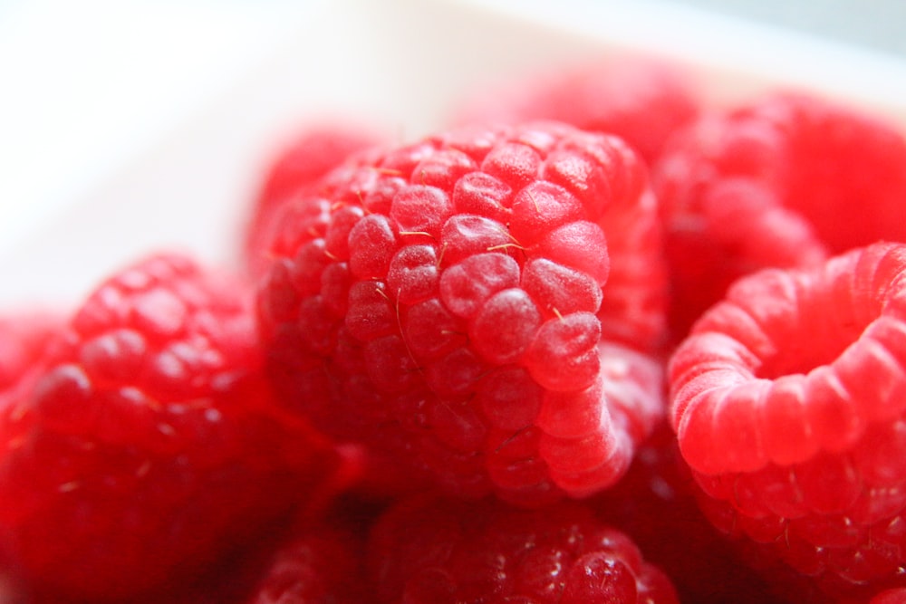 red round fruits on white ceramic plate