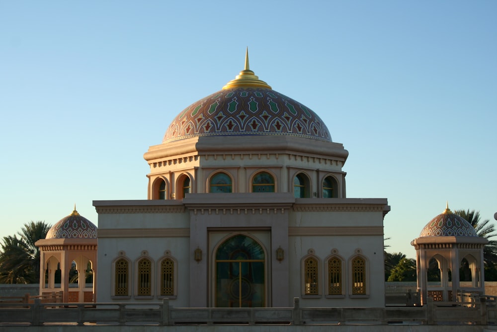 white and green dome building under blue sky during daytime