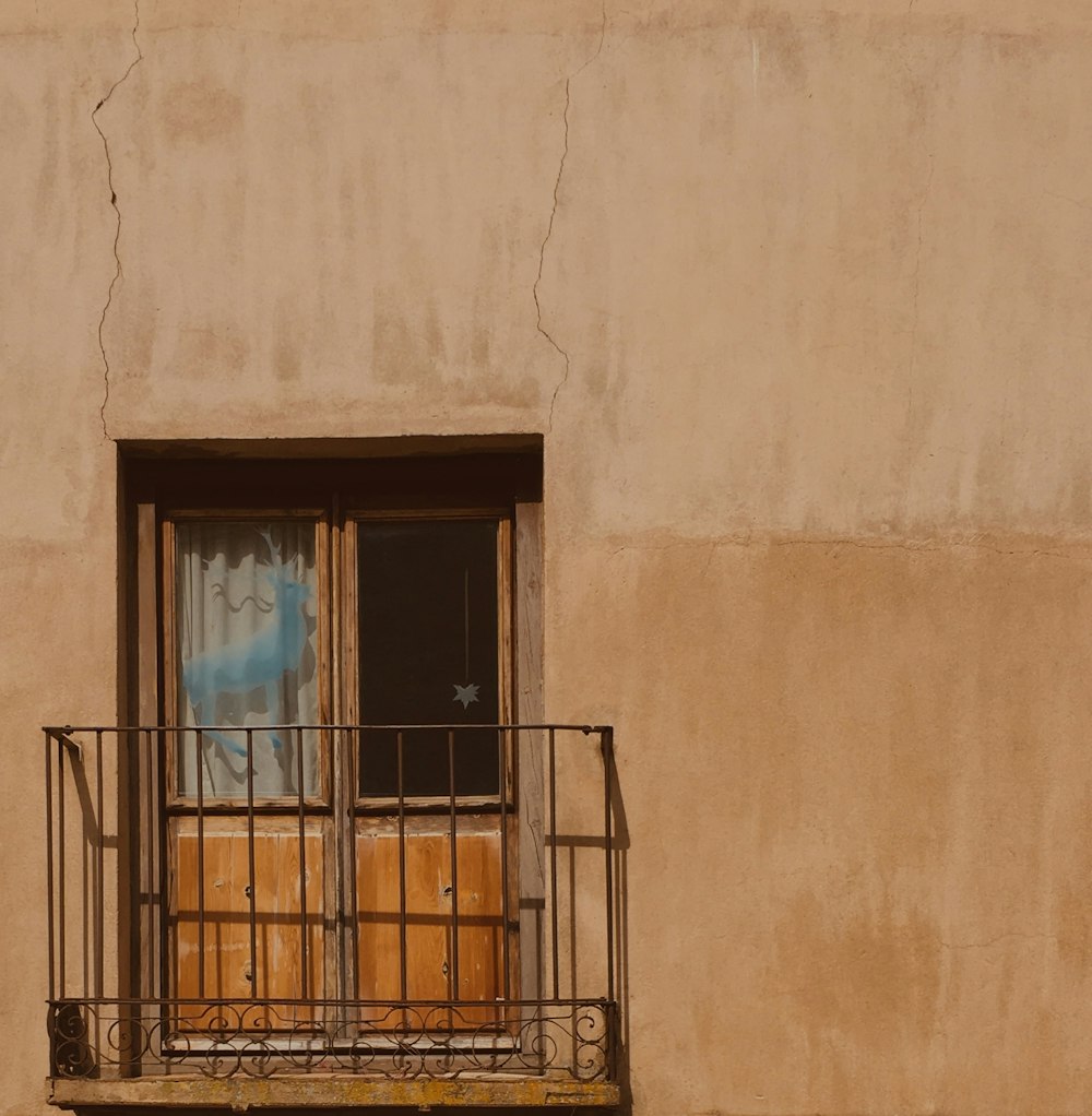 brown metal window frame on brown concrete wall