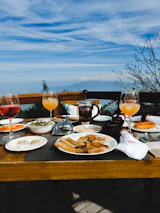 Charming breakfast table set with fresh local food and coffee.