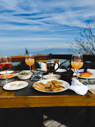 Breakfast table set in the main dining room with fresh pastries, coffee, and garden views.