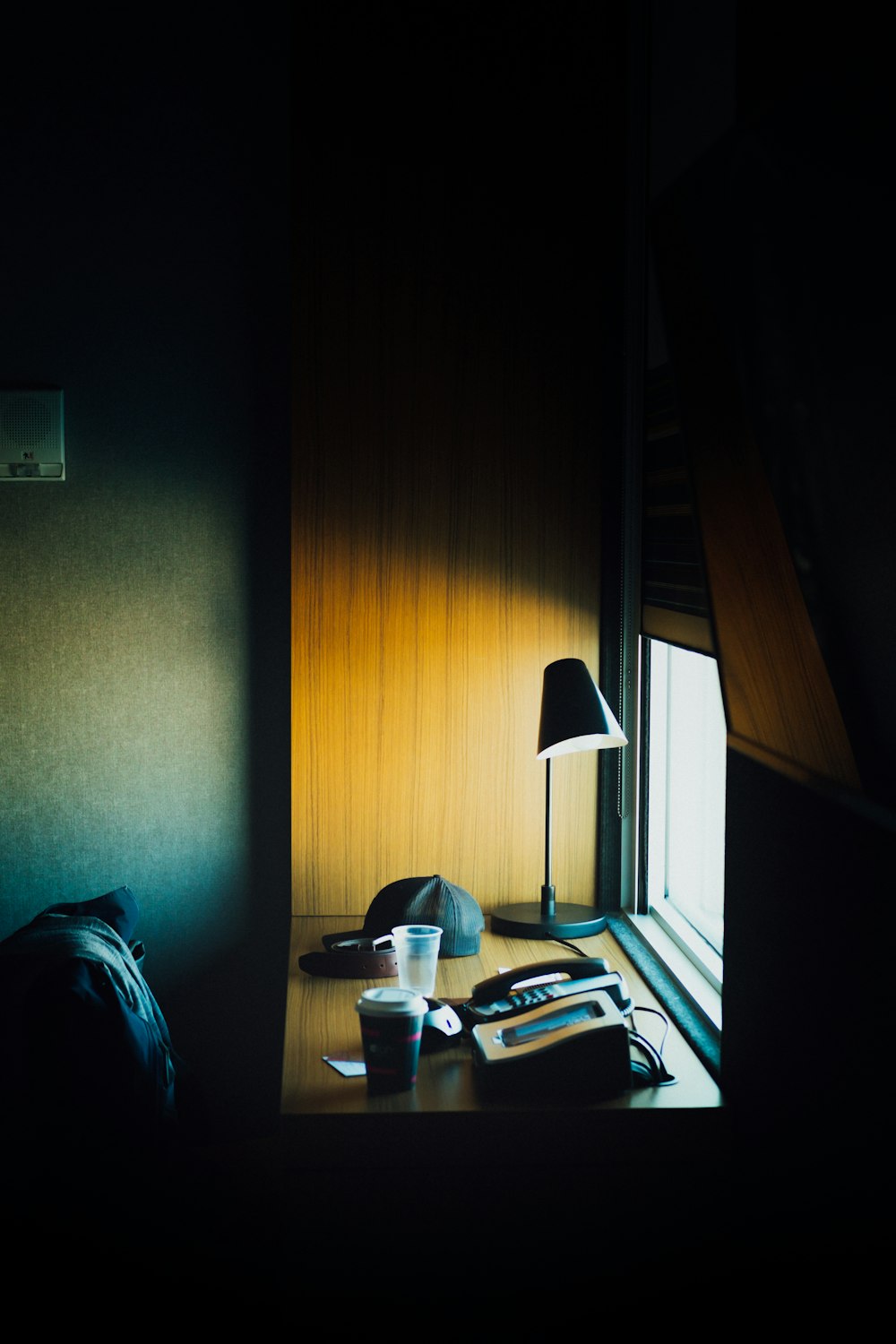 black and white table lamp on brown wooden table